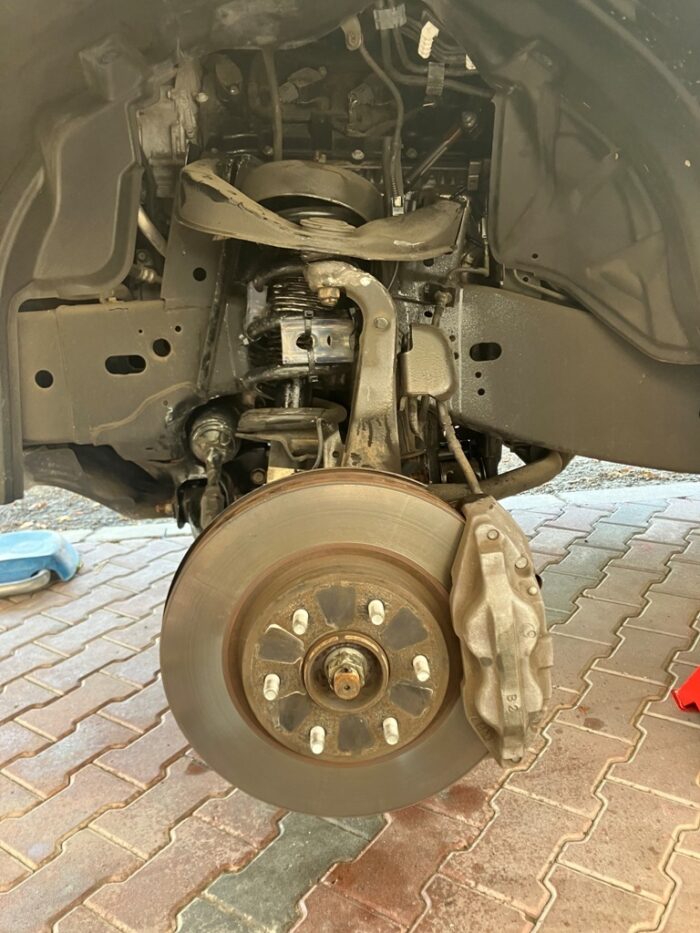 Urethane buffers installed on Nissan Patrol front left wheel