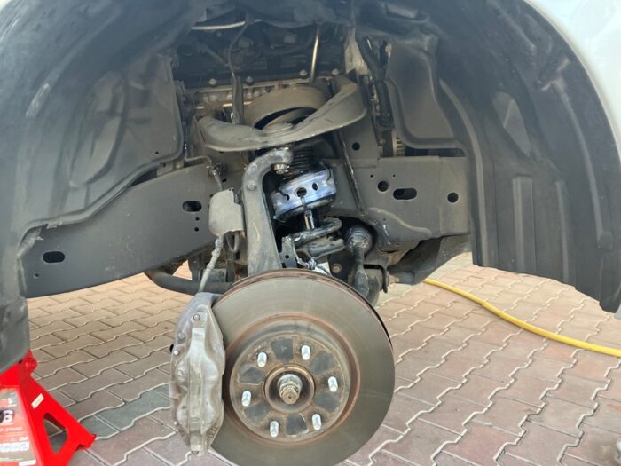 Urethane buffers installed on Nissan Patrol front right wheel
