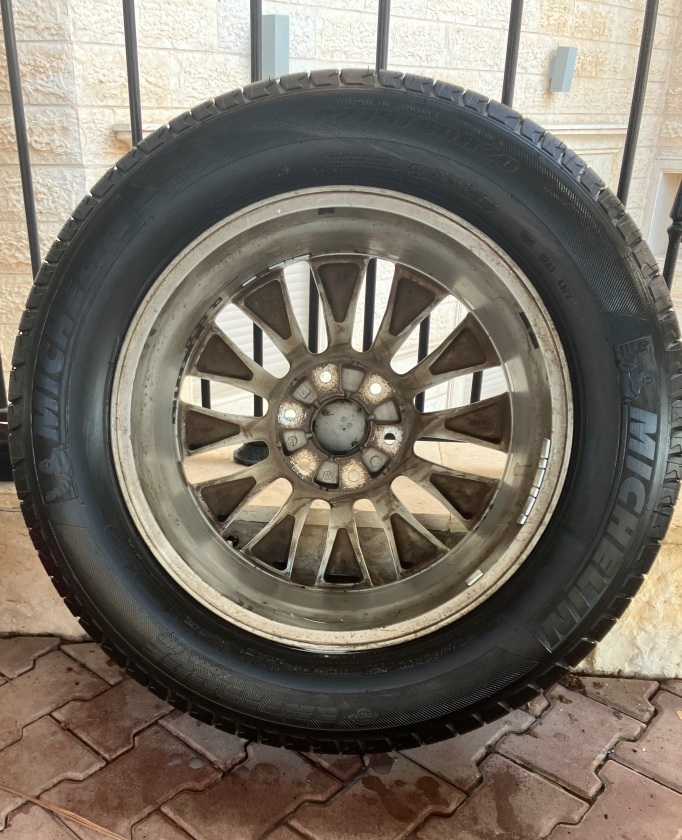 Washing Nissan Patrol and treating inner tire wall with rubber protectant and conditioner.